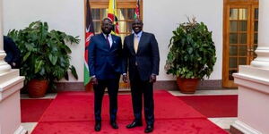 Nigerian national, Alexander Ezenagu and president William Ruto pose for a photo at State House on September 13, 2022.