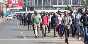 An image of people walking along a road in Nairobi