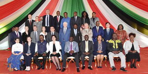 European Union Ambassador to Kenya, Henriette Geiger and President William Ruto pose for a photo with other diplomats 