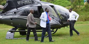 Former Prime Minister Raila Odinga stepping out of Jimmy Wanjigi's Eurocopter.