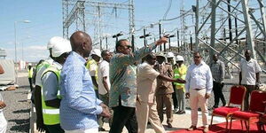 President William Ruto and his predecessor, Uhuru Kenyatta, tour the Lake Turkana Wind Power project in July 2019