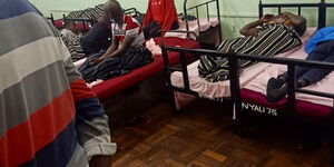 Quarantined individuals at the Kenya High School sleeping close to each other.