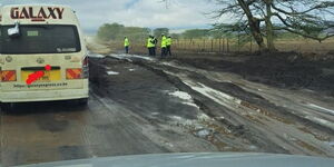 Police officers assess the situation at the Suswa area along the Narok-Maai Mahiu Road on March 22, 2023. 