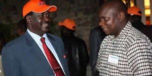 ODM Party Leader Raila Odinga with ODM Communication Director Philip Etale. Photo undated.