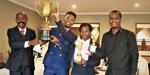 Raphael Gitau and Gladys Nyangweso receiving their awards
