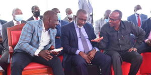 President William Ruto (left) chats with CSs Mithika Linturi (center) and Aden Duale.
