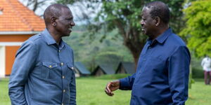 President William Ruto conversing with Former Prime Minister Raila Museveni during a meeting in Uganda on February 26, 2024.