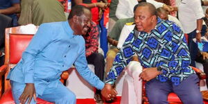 Former Prime Minister Raila Odinga and former President Uhuru Kenyatta conversing during an Azimio meeting on March 12, 2022.