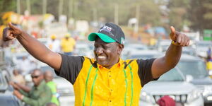President William Ruto gesturing a thumbs up during a rally in July 2022. 