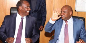 Treasury CS Ukur Yattani (Left) with KRA Commissioner-General Githii Mburu  (right) at Treasury Buildings in May 2020.