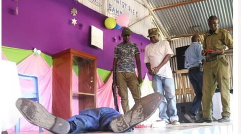 Pastor Elijah Misiko of 3 G Ministries laying on the floor after he stabbed himself