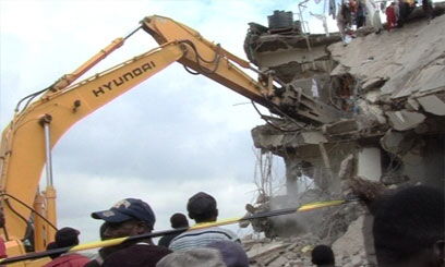 A bulldozer demolishes a house in Eastleigh in 2011