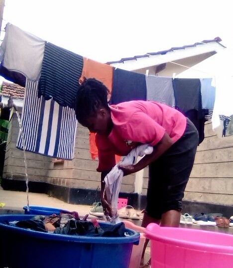 An undated Image of a laundry lady Lucy Gatimu washing clothes.