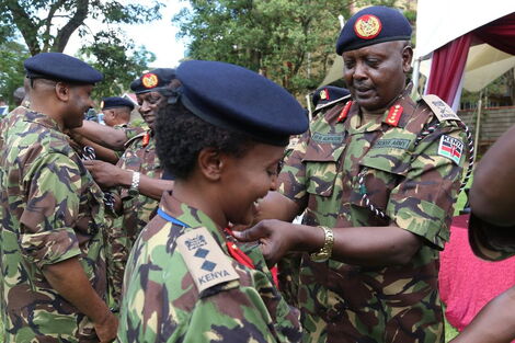 Army Commander Lt General Robert Kibochi elevating an officer to Colonel rank.