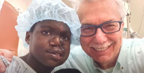 Doctor Leon Klempner posing for a photo with Saline Atieno taken on June 8, 2021.