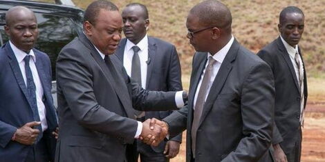 File image of President Uhuru Kenyatta and State House Chief of Staff Nzioka Waita.