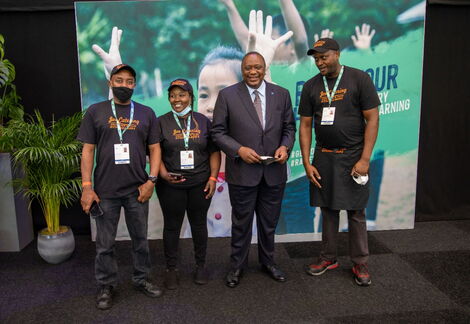 Joe's catering team posing with President Uhuru Kenyatta