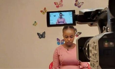 KTN anchor Grace Kuria taping a news briefing from her home.