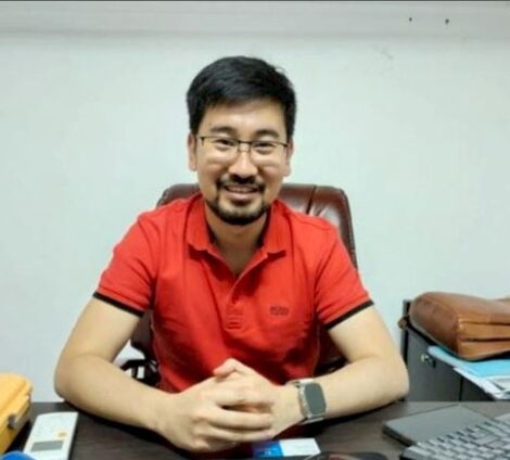 China Square proprietor, Lei Cheng poses for a photo inside his office on February 25, 2023. 