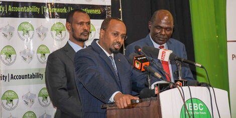 Former IEBC commissioners Moya Bolu, Abdi Guliye and Chair Wafula Chebukati during the launch of the launch of the 2022 Post-Election Evaluation Report on Monday, January 16, 2023.