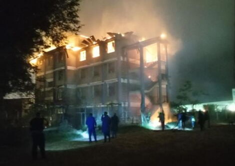 Police officers at Highway Secondary School after fire broke out