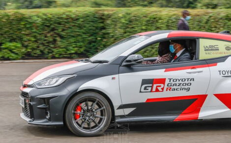 President Uhuru Kenyatta drives a Safari Rally car at State House on Thursday, June 17, 2021.