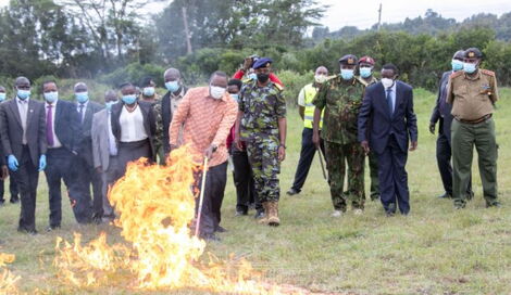 President Uhuru Kenyatta sets 5,144 guns ablaze at the Regional Police Traffic Training Centre in Ngong, Kajiado County.
