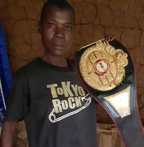 Award winning boxer Conjestina Achieng' poses for a photo after being visited by journalist Carol Radull on December 10 2020
