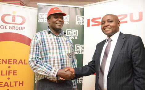 SME owner Silas Odero of Nyakinda Construction with Co-op Bank head of business banking Moses Gitau during the launch of the Co-op Bank - Isuzu East Africa Motor Vehicle Purchase Scheme for SMEs.