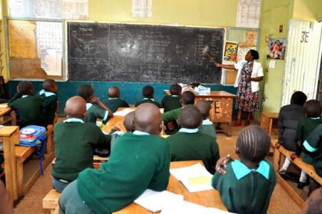 A teacher and students inside a classroom at Kawangware Primary School, Nairobi, on October 5, 2015