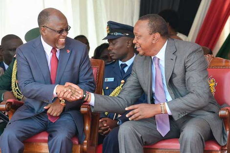 President Uhuru Kenyatta shares a light moment with Tanzanian President John Magufuli during the commissioning of Southern Bypass at Ngong Road-Lenana Interchange in Nairobi. Kenya is fuming at her neighbours over cows, chicken and fish, 2019. 