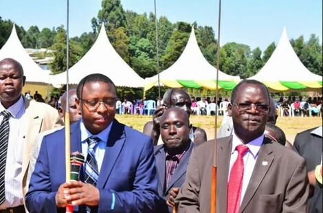 West Pokot Governor John Lonyangapuo (right) and his deputy Nicholas Atudonyang during a past ceremony.