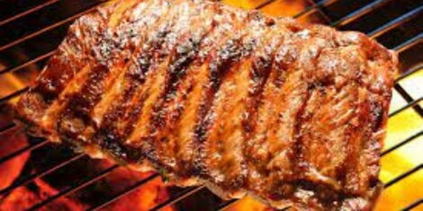 an image of nyama choma on a grill