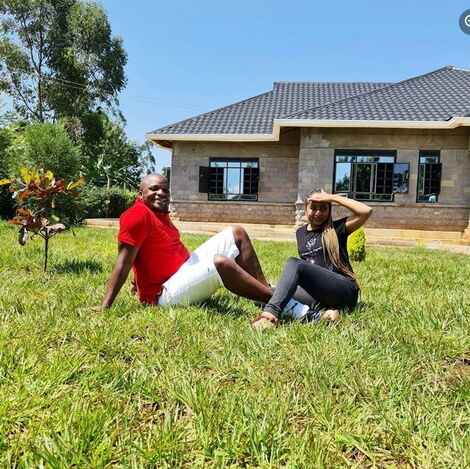 Jalang'o and his wife Amina Chao pose for a photo in front of their Siaya home.
