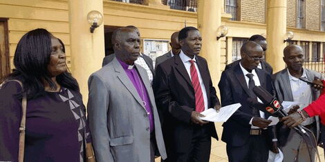 National Parents Association Chairman David Silas Obuhatsa (in red tie) during a press briefing at Milimani Law Courts on September 20, 2022.