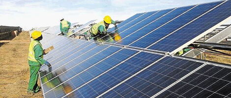 File photo of installer fixing solar panels in one of the mega projects in Kenya