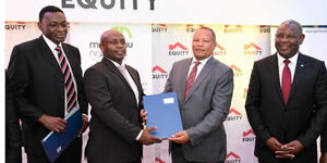 Mwalimu National Sacco Chairman, Joel Gachari (2nd left) exchanges agreement documents with Equity Bank Kenya Managing Director, Gerald Warui (2nd right). Looking on is Equity Group Managing Director and CEO, Dr. James Mwangi (right) and Spire Bank Board Chairman, William Rahedi (left).