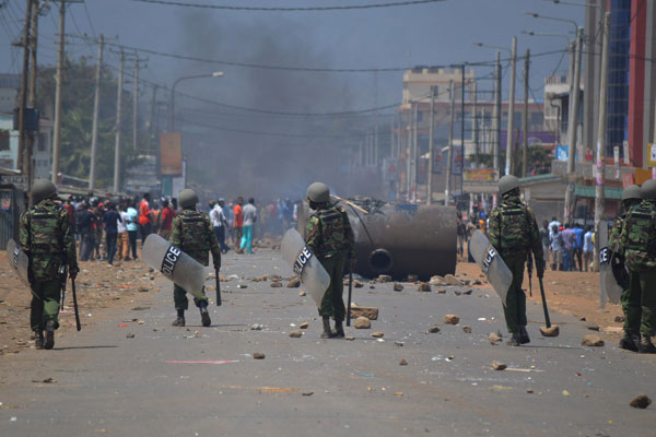 Angry protestants engage police during post election violence in Kisumu region.