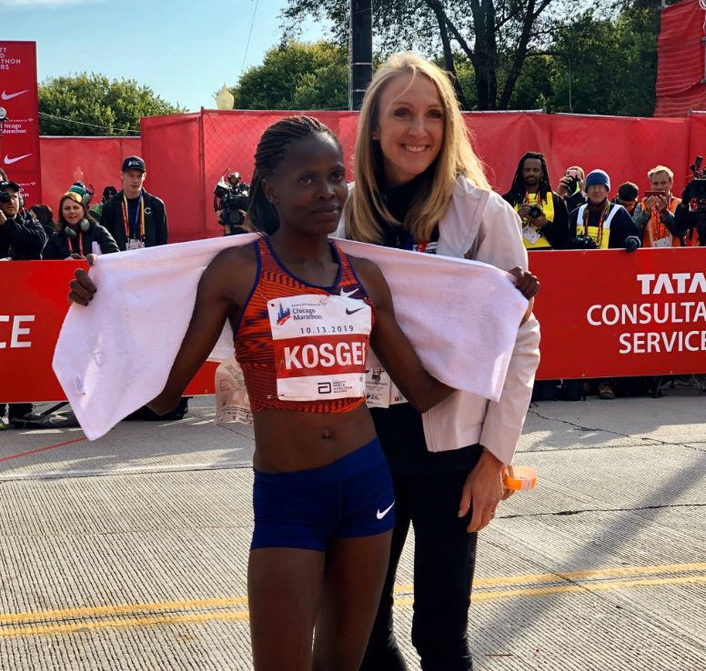 Former world record holder Paula Radcliffe poses with Brigid Kosgei at the finish after Kosgei broke the record at the 2019 Chicago Marathon.