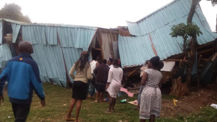 People who rushed to the school to rescue trapped pupils after their classroom caved in. A class eight girl succumbed after sustaining serious injuries.