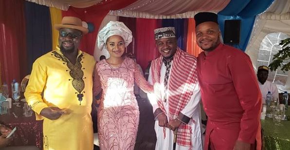 Comedian Jalang'o poses for a photo with some of the people who attended his wedding.
