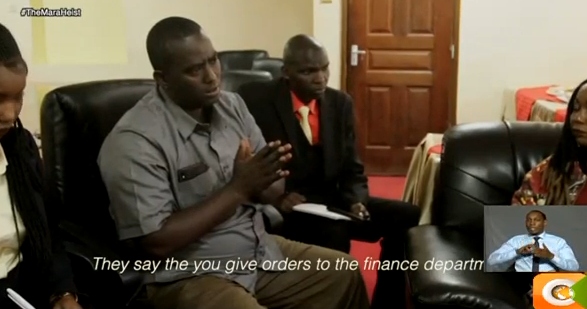 Prof Walingo's driver, Mr. Abdi Noor (in grey shirt), who would often be send to collect the bundles of money immediately they were withdrawn.