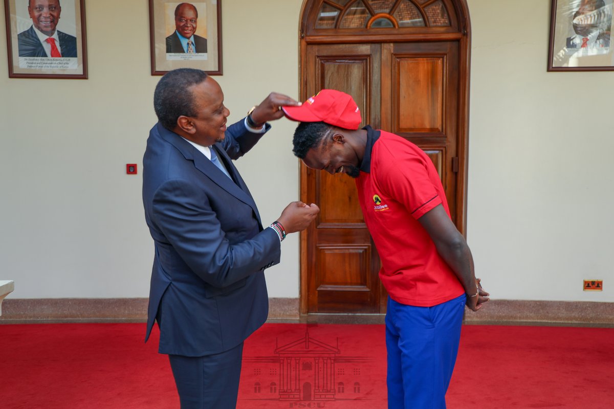 President Uhuru Kenyatta (left) goofs around with McDonald Mariga  at State House while endorsing him for Kibra Parliamentary seat.