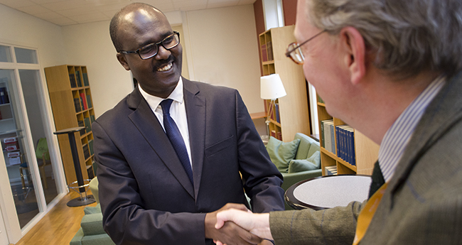 Mr. Gilbert Sebihogo, NANHRI’s Executive Director, shaking hands with Rolf Ring, RWI’s Deputy Director,