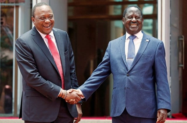 President Uhuru Kenyatta (L) greets opposition leader Raila Odinga after addressing a news conference at the Harambee house office in Nairobi, Kenya March 9, 2018.