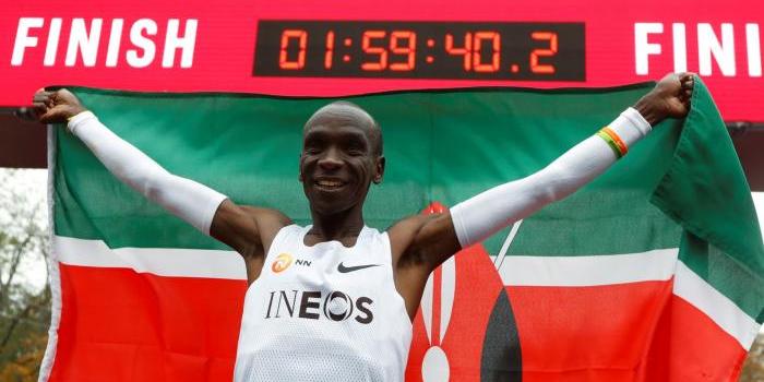 Eliud Kipchoge celebrating after breaking the 2-hour barrier for a 42-kilometre race, having run for 1.59.40.