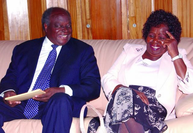 Mama Lucy Kibaki and President Mwai Kibaki share a light moment at a past event. 