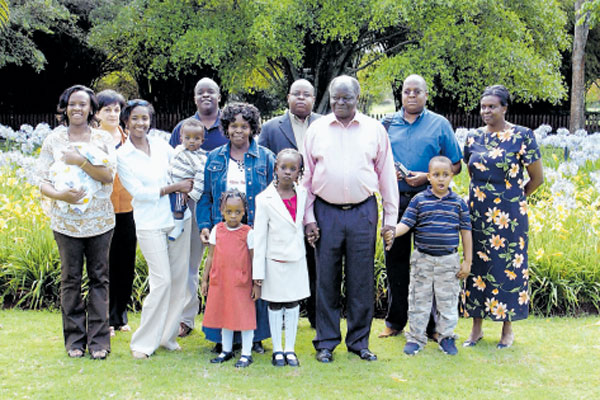 Mama Lucy Kibaki and then President Mwai Kibaki pose for a photo with their family members at State House, Nairobi. 