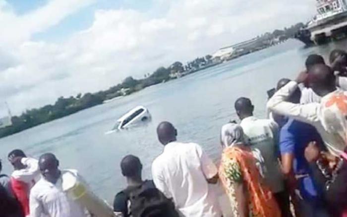 Onlookers at the Island side ramp of the Likoni channel in Mombasa, Kenya, where a vehicle plunged into the Indian Ocean. September 29, 2019.
