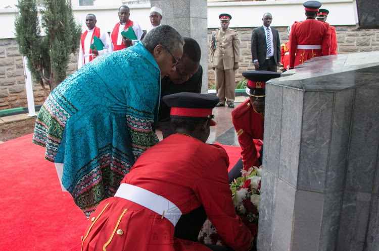 President Uhuru Kenyatta and First Lady Margaret Kenyatta lay a wreath of flowers at the mausoleum of founding President Mzee Jomo Kenyatta on August 22, 2019. 